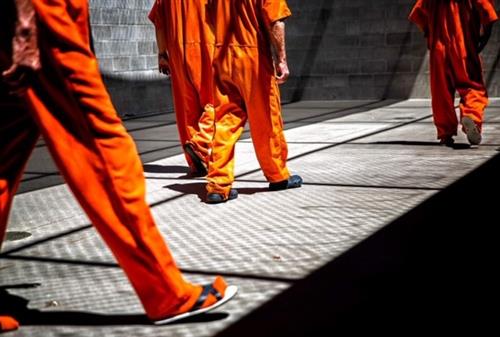 Inmates at the Twin Falls County Jail in Twin Falls, Idaho walk the year during their recreation time. 